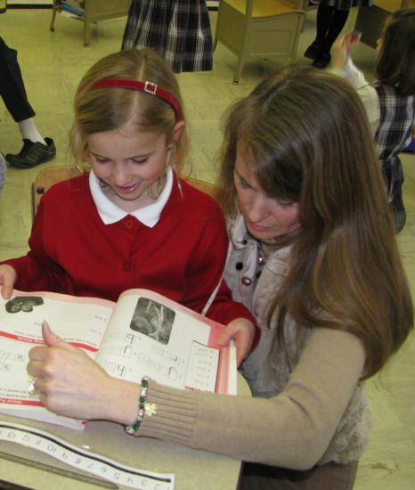 teacher helping student